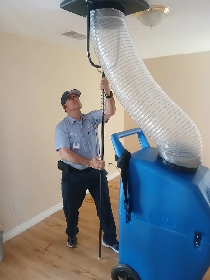 Furnace Tune-Up technician using HEPA equipment in Washington
